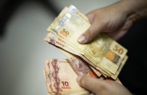 Valor médio do Auxílio Brasil até agora é de R$ 217: veja calendário de pagamentoBenefício reduzido